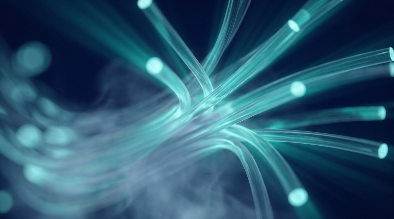 Abstract close-up of glowing optical fiber strands in deep navy and electric teal, with soft internal luminescence and diffused light rays suggesting high-power signal amplification through fiber optic cables.